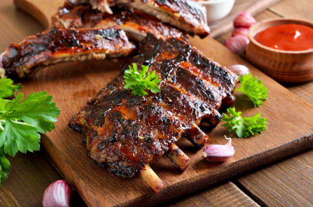 istock Spicy hot grilled spare ribs on cutting board 1183544326