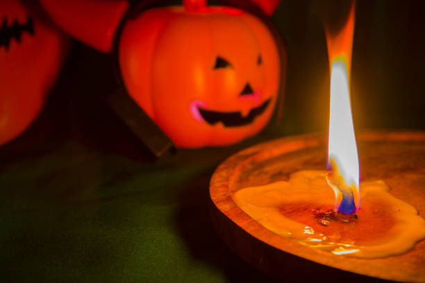 istock Halloween pumpkin head jack lantern with burning candles 1183548682