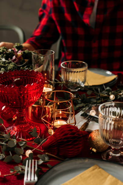 Man sitting by set christmas table