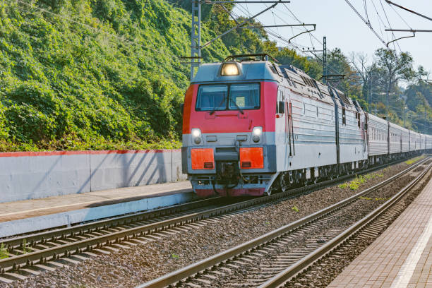 istock Passenger train moves along the platform by Black sea coast. Sochi. 1183549898