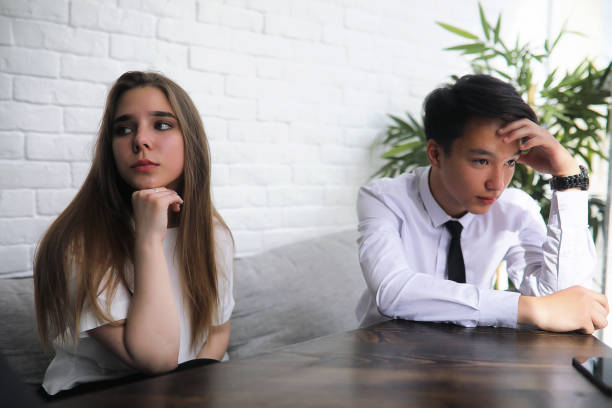 istock A pair of young people talking at the office 1183550315