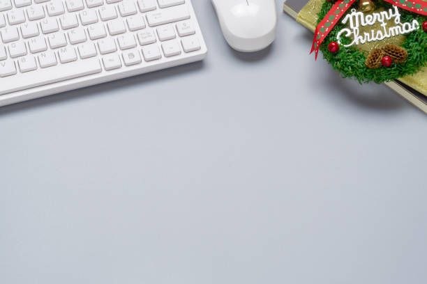 istock Merry Christmas and Happy new years office work space desktop concept. Flat lay top view with keyboard and Christmas ornaments with copy space. 1183550516