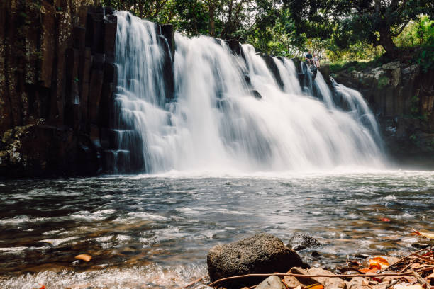 istock Rochester Falls and black rocks. Waterfall in Mauritius 1183551487