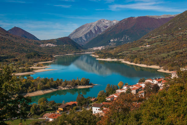 Barrea Lake is surrounded by the uncontaminated tops of the Apennines. Three adorable villages are reflected in its water: Barrea, Villetta Barrea, Civitella Alfedena Barrea Lake is surrounded by the uncontaminated tops of the Apennines. Three adorable villages are reflected in its water: Barrea, Villetta Barrea, Civitella Alfedena, Italy ancient villages stock pictures, royalty-free photos & images