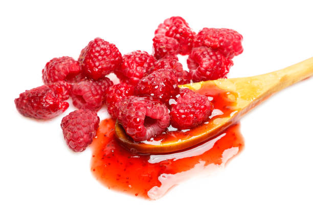 istock Raspberries and jam in the spoon 1183558939