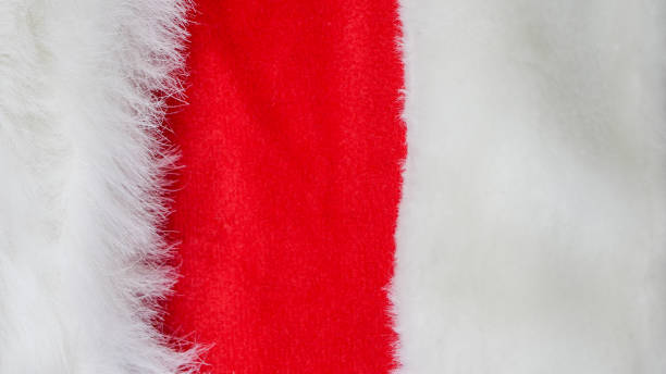 istock red and white fabric christmas background, red cloth and soft white fur 1183560746
