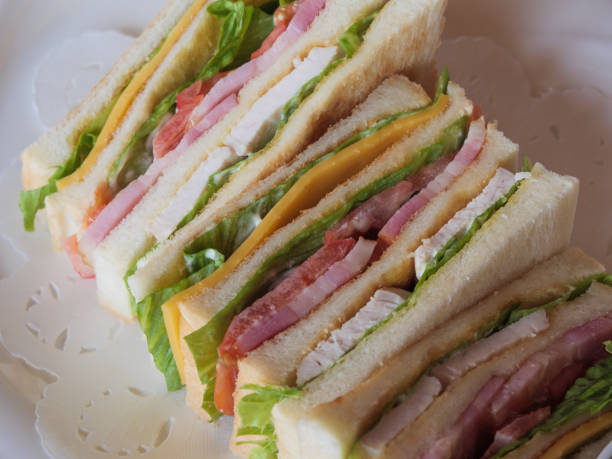 istock A delicious looking club sandwich on a white plate 1183561904