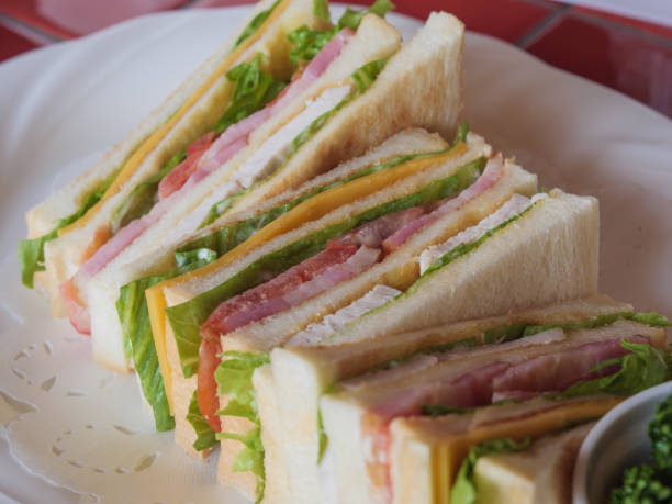 istock A delicious looking club sandwich on a white plate 1183561908