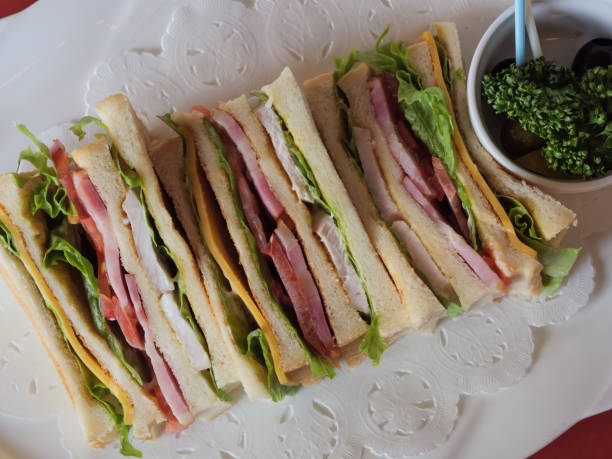 istock A delicious looking club sandwich on a white plate 1183561916