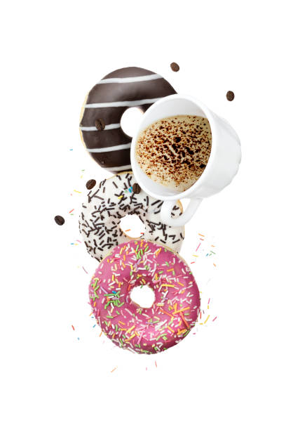 istock Sweet donuts with white cup coffee flying in motion or falling 1183564199