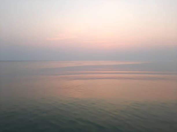 istock Indigo sea with an orange sky at dawn 1183564242