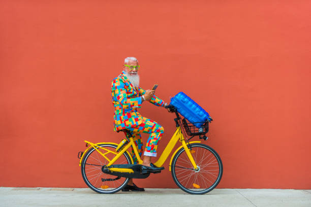 Stylish hipster senior man Hipster senior man with extravagant style portrait hipster bike stock pictures, royalty-free photos & images