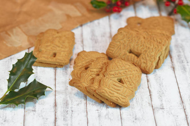 istock 'Speculaas' or 'speculoos', a spiced thin, crunchy and caramelizedand shortcrust biscuit with figure stamped on the front side, traditionally baked in Europe in Christmas season 1183566049