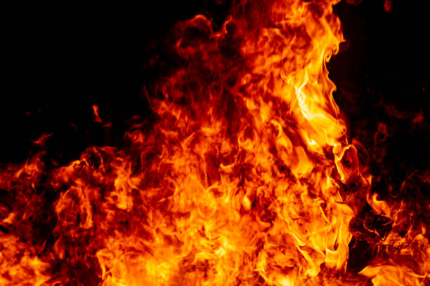 istock Abstract fire flame burn glowing on fuel in dark night background 1183568303