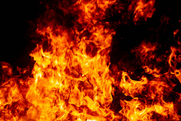 istock Abstract fire flame burn glowing on fuel in dark night background 1183568325
