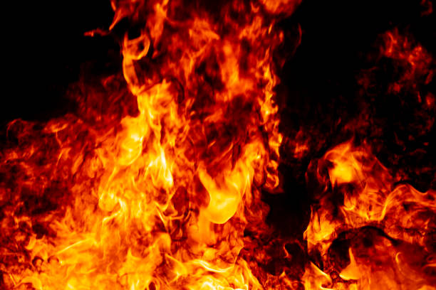 istock Abstract fire flame burn glowing on fuel in dark night background 1183568326