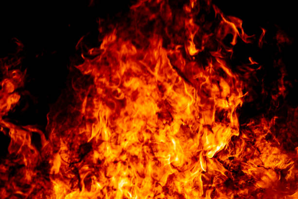 istock Abstract fire flame burn glowing on fuel in dark night background 1183568347