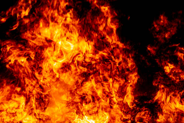 istock Abstract fire flame burn glowing on fuel in dark night background 1183568355
