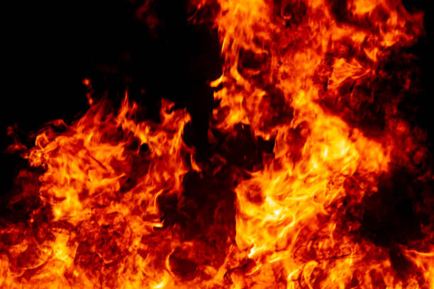 istock Abstract fire flame burn glowing on fuel in dark night background 1183568356