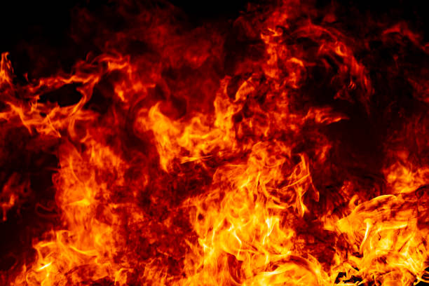 istock Abstract fire flame burn glowing on fuel in dark night background 1183568379