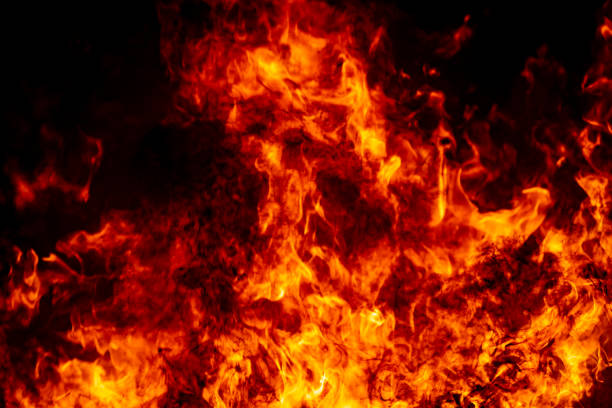 istock Abstract fire flame burn glowing on fuel in dark night background 1183568411