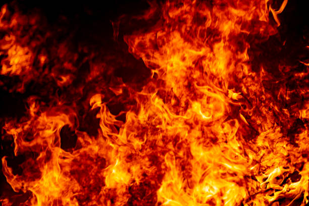istock Abstract fire flame burn glowing on fuel in dark night background 1183568419
