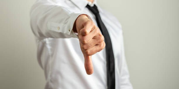 istock Businessman showing thumb down sign 1183568716