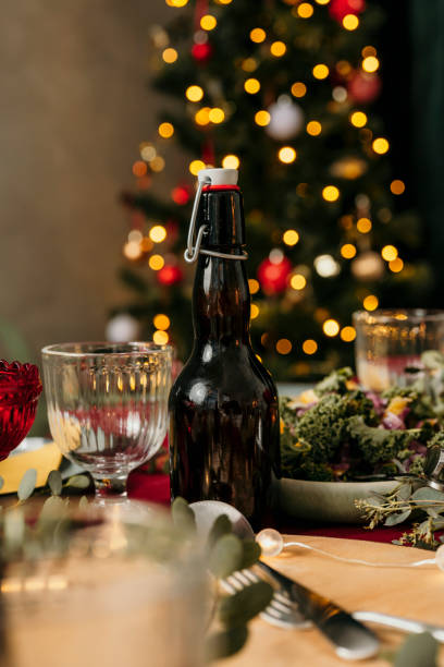 istock Christmas beer bottle on set table 1183568809