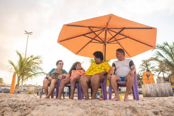istock Tourists on the beach under a tent 1183570388