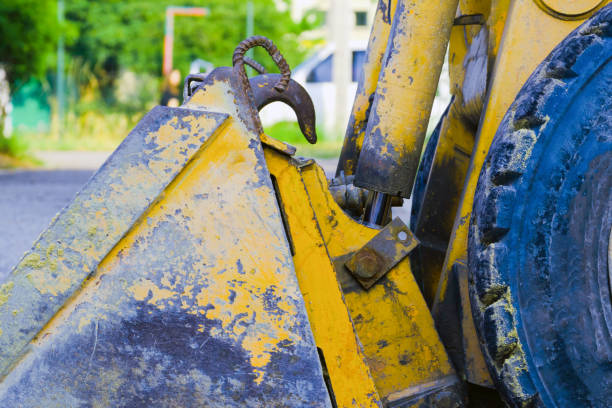 istock small yellow bulldozer loader bucket. scratched old metal. construction work concept 1183570513