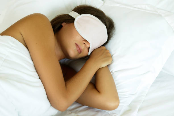 istock Sleeping woman with eye mask 1183570610