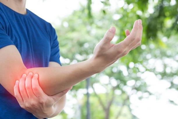 Picture of a man with elbow pain stock photo