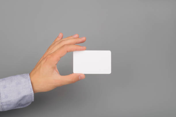 istock hand holds white business card 1183573076