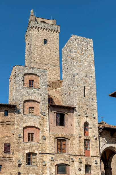 San Gimignano Siena Tuscany tower Ardinghelli and Torre Grossa in the square of the cistern