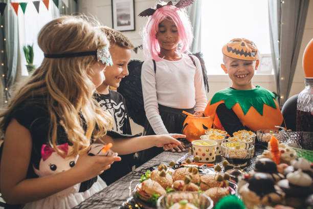 istock Kids eating on Halloween party 1183576454