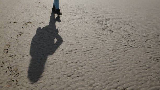 istock Hiking on the Beach 1183577786