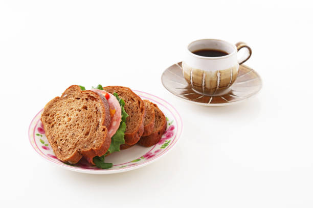 A cup of coffee and sandwiches