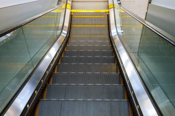 istock Interior design empty escalator stairs in the airport 1183579244