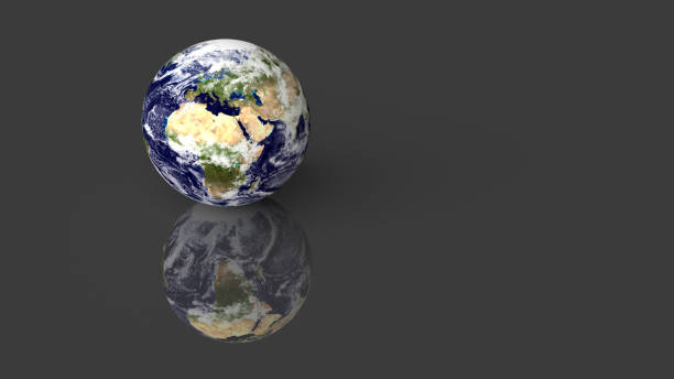 istock Planet Earth placed on grey glossy desk with reflection. 3D render. Elements of this image furnished by NASA. 1183581410