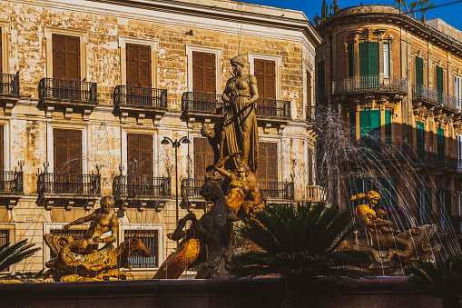 Closeup view over the fountain of Diana on Archimede's square in Ortygia island in ancient city Syracuse in Sicily, southern Italy