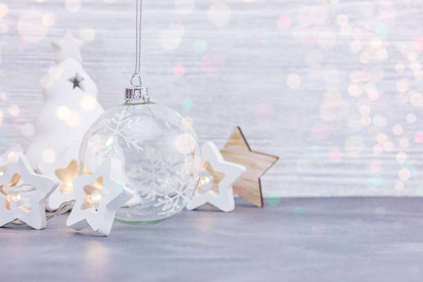 istock new year festive decorations on white wooden background 1183590411