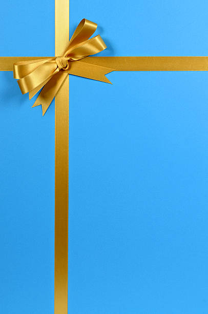 istock Gold gift ribbon on blue 118359173