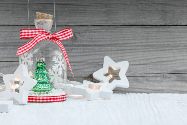 istock christmas tree and home decorations on wooden boards background 1183592520