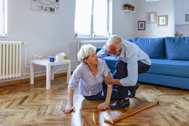 Senior woman with heart attack and headache fall down at home Old men helping wife who falled down on floor Home Safety for Dementia stock pictures, royalty-free photos & images
