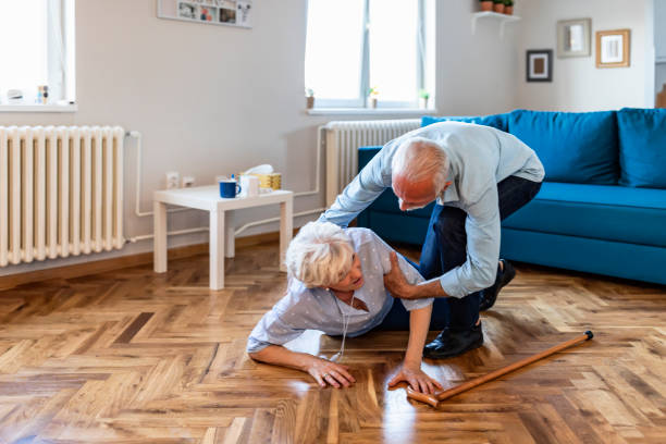 istock Senior woman with heart attack and headache fall down at home 1183594748