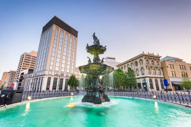 Montgomery, Alabama, USA fountain and downtown cityscape at twilight.