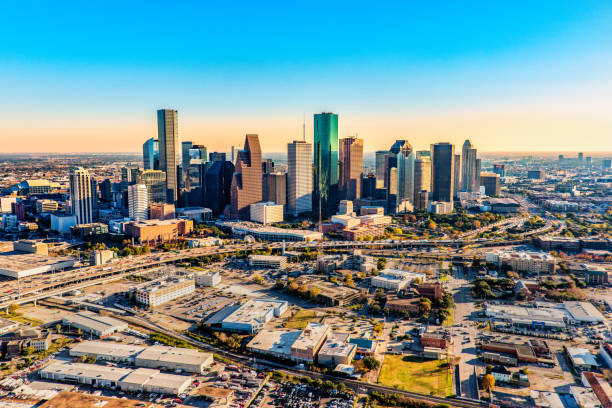 Aerial Skyline of Houston Downtown Houston Texas shot near dusk from an altitude of about 1200 feet over the city. houston skyline stock pictures, royalty-free photos & images