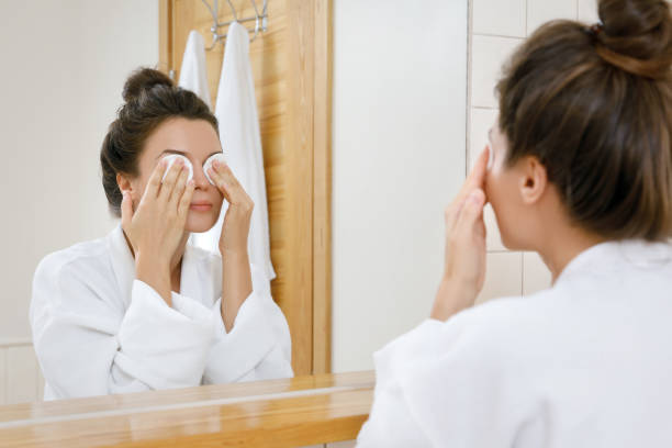 Woman with a cotton pads on her eyes stock photo