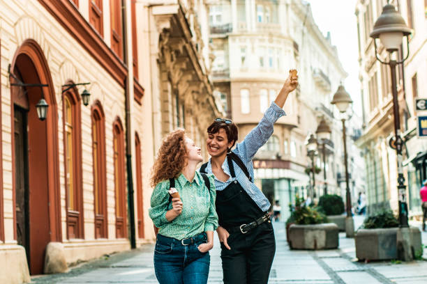 istock Two young femail friends eating ice cream 1183605190