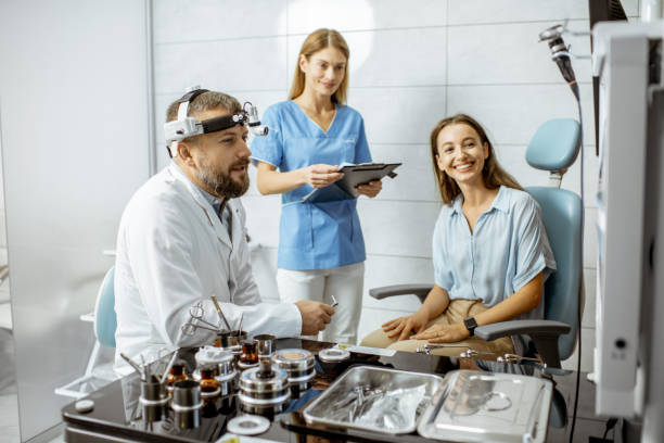 istock Patient with doctors in ENT office 1183605256